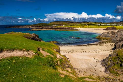a view of a beach with the ocean at The Hideaway in Lochinver