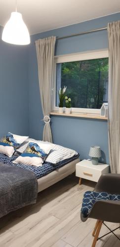 Un pat sau paturi într-o cameră la Sasinko
