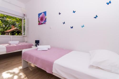 Posteľ alebo postele v izbe v ubytovaní Apartman Sun Solin