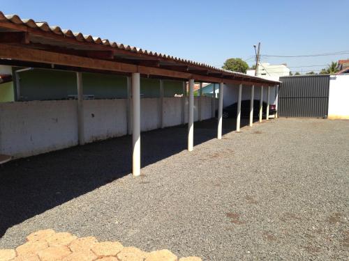 a building with a long row of poles at Hotel Itatiaia in Tangara da Serra