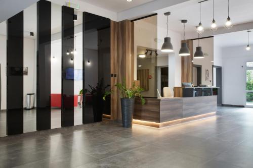 an office lobby with black and white striped walls at HOMER Bydgoszcz in Bydgoszcz