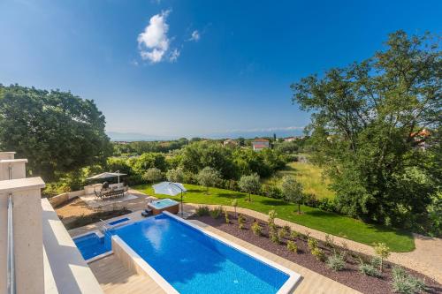 an overhead view of a swimming pool in a yard at Villa Roko in Malinska