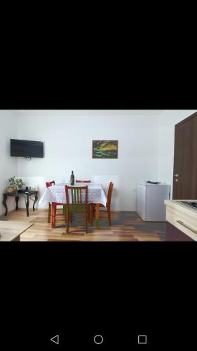 a kitchen with a table and chairs in a room at Apartment Luskino 22 in Matulji
