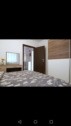 a bedroom with a large bed in a room at Apartment Luskino 22 in Matulji