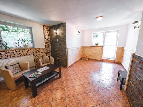 a living room with a couch and a table at Hostel & Apartments u Florka 2 in Zakopane