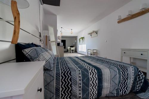 a bedroom with a bed in a room at Apartamento Loft Sopranis in Cádiz