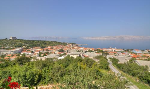 a view of a town with the water in the background at Josipa & Jelena Apartment in Senj