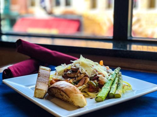 a plate of food on a table with food on it at Mineral Palace Hotel & Gaming in Deadwood