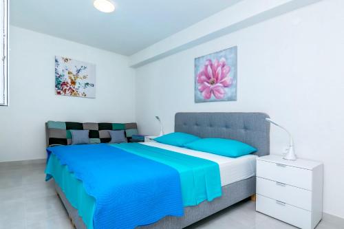 Postel nebo postele na pokoji v ubytování Apartments Hrgovic