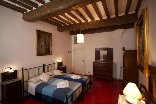 Letto o letti in una camera di Appartamento raro, in palazzo d’epoca del 1400.