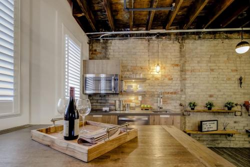 a kitchen with a table with a bottle of wine at The Westlake in Toronto