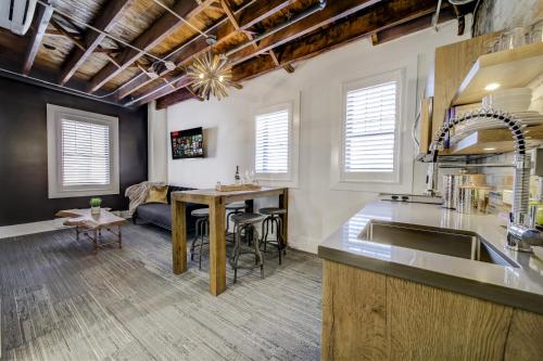 a kitchen and living room with a sink and a table at The Westlake in Toronto