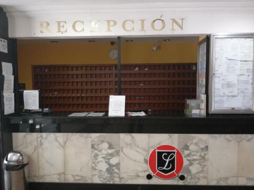 a restaurant with a reputation sign on a counter at Hotel El Limón in Caracas