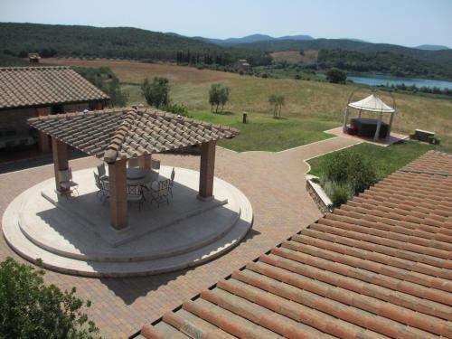 a pavilion with a table and a gazebo at Agriturismo Il Felciaione in Massa Marittima