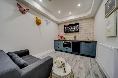 a living room with a couch and a table at The Westlake in Toronto