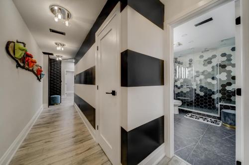 a hallway with black and white walls at The Westlake in Toronto