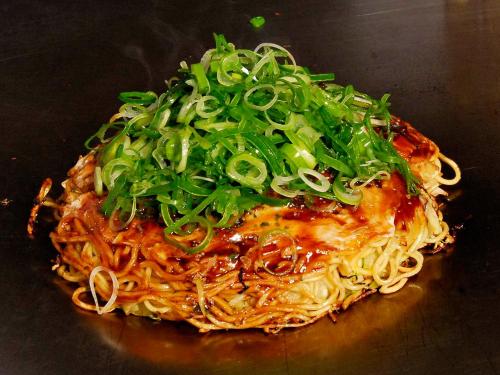 a pile of noodles with green onions on top at Global Resort Miyajima View in Hatsukaichi