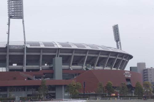 a large soccer stadium with a large roof at Vessel Inn Hiroshima Station in Hiroshima