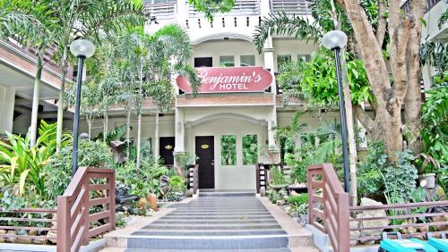 a building with a sign that reads the entrance to a hotel at Villa Esmeralda Bryan's Resort Hotel and Restaurant in Palayan City