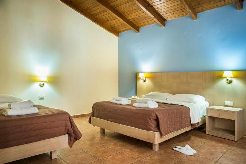 Postel nebo postele na pokoji v ubytování Lassi Hotel