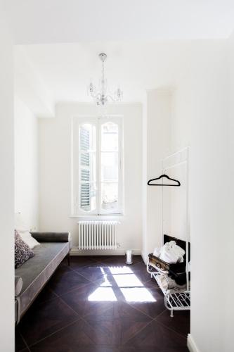 a living room with a couch and a window at Alessia's Place in Como