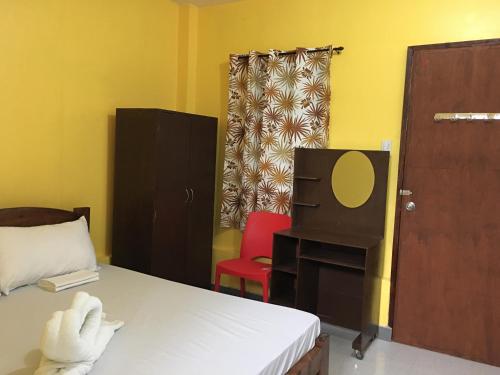 Postel nebo postele na pokoji v ubytování Panglao Rainbow Inn