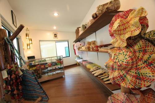 a store with a lot of shoes on the shelves at Coron Hilltop View Resort in Coron