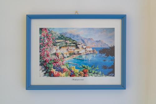 a framed picture of a painting of positano at Panoramic Terrazza - Località Maiori in Maiori