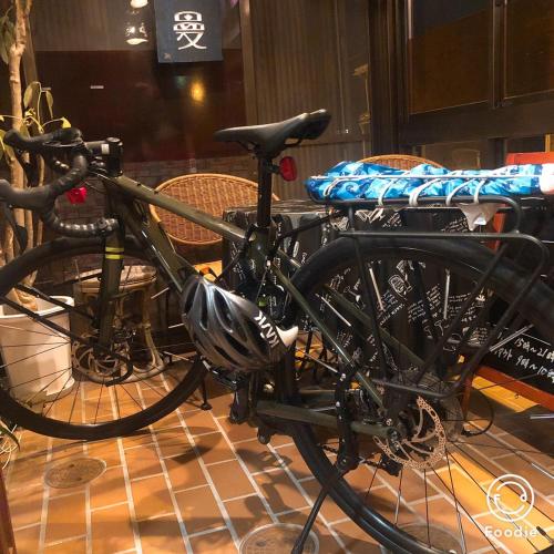 a bike parked on display in a room at Guest house daisho oshiro asobi in Matsue