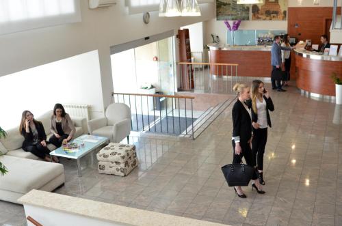 a group of people standing in a lobby at Hotel Neboder in Rijeka