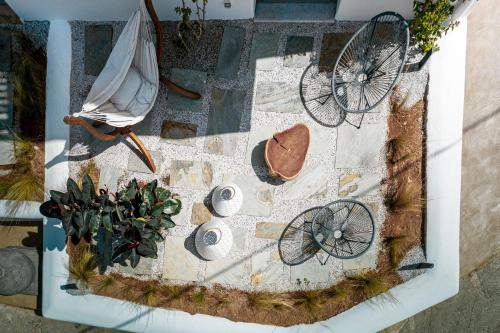an overhead view of a table with an umbrella and a bicycle at Bohemian Luxury Boutique Hotel, Adults Only in Naousa