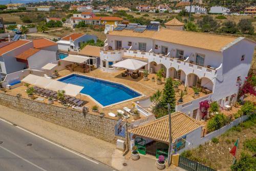 an aerial view of a house with a swimming pool at Vila Channa - Adults Only in Albufeira