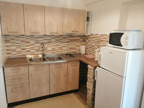 Kuchyň nebo kuchyňský kout v ubytování Apartments Jasna