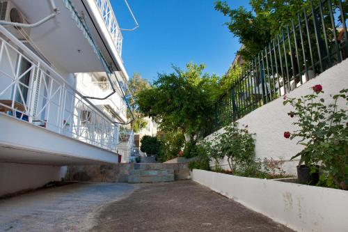 an alleyway next to a building with a balcony at Erato Apartments in Petalidhion