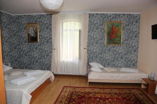 Postel nebo postele na pokoji v ubytování New Aosta Garden