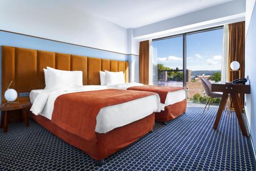 Postel nebo postele na pokoji v ubytování Zemeli Boutique Hotel by DNT Group