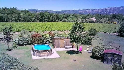 an aerial view of a yard with a swimming pool at 349 Les Maridats in Bédoin
