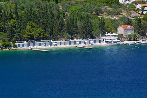 a resort on the shore of a large body of water at House Lara in Vela Luka