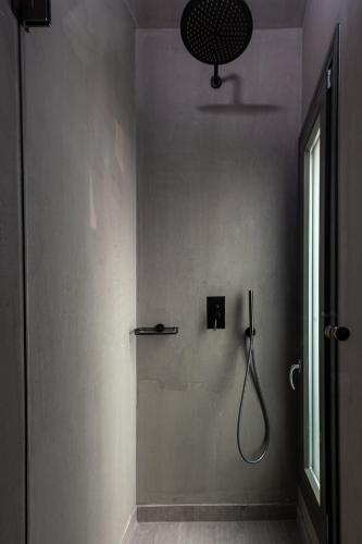 a bathroom with a shower stall and a shower at Bohemian Luxury Boutique Hotel, Adults Only in Naousa