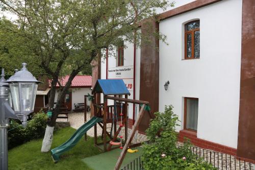 a playground in the yard of a house at New Aosta Garden in Sinaia