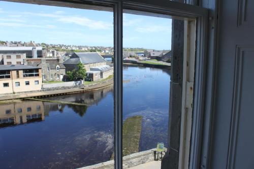 a view of a river from a window at Mackays Hotel in Wick