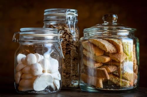 two glass jars filled with different types of food at La Rimbecca Greve in Chianti in Greve in Chianti