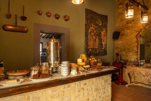 a buffet of food on a counter in a room at La Rimbecca Greve in Chianti in Greve in Chianti