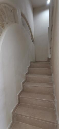 a staircase in a building with a stair case at San Pietro al Borgo in Molfetta