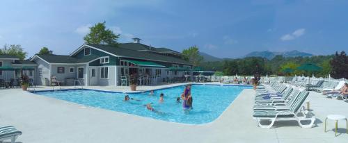 a group of people in a pool at a resort at Stoweflake Mountain Resort & Spa in Stowe