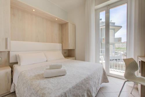 Кровать или кровати в номере Hotel Olympia