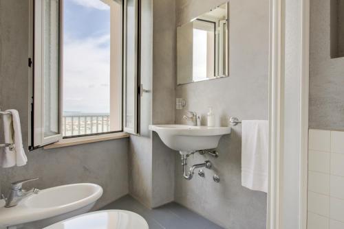 Koupelna v ubytování Hotel Olympia