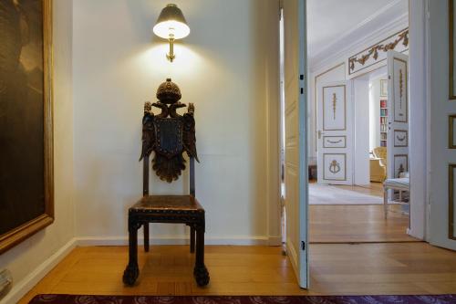 a chair sitting in the middle of a hallway at Mauritzbergs Slott & Golf in Mauritsberg