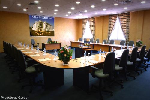 a large conference room with a long table and chairs at Relax Hotel Airport Nouasseur in Nouaseur