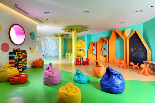 a room with a bunch of colorful plastic bags in it at Grand Palladium Select Costa Mujeres - All Inclusive in Cancún